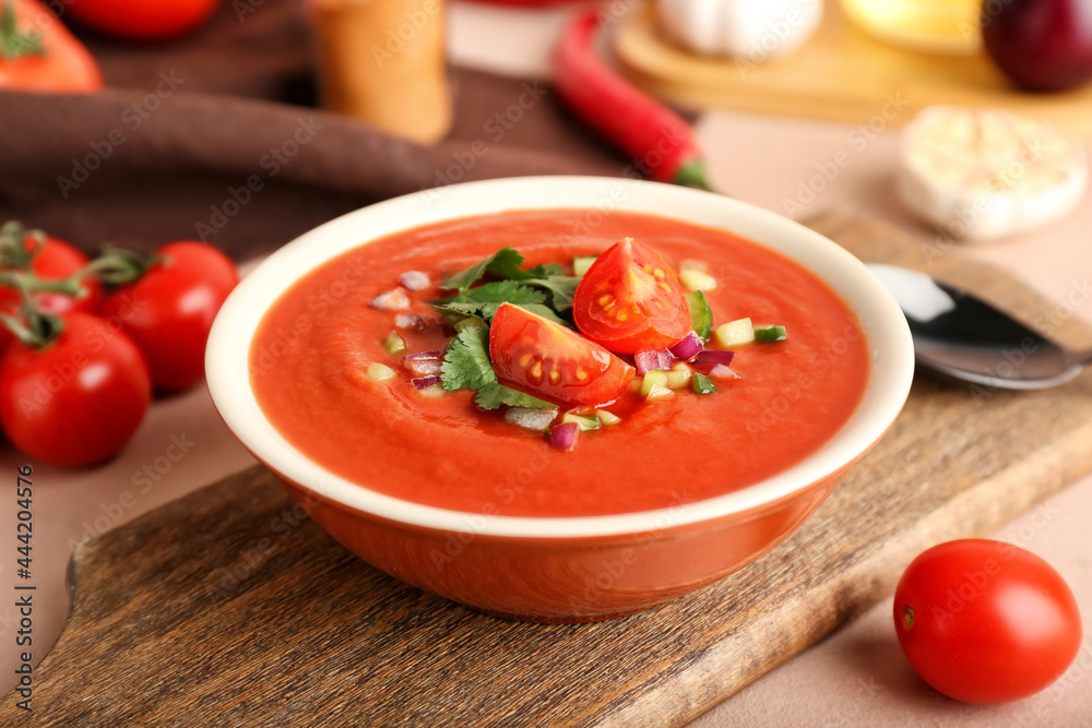 Bowl with tasty gazpacho on color background, closeup Bowl with tasty gazpacho on color background, closeup