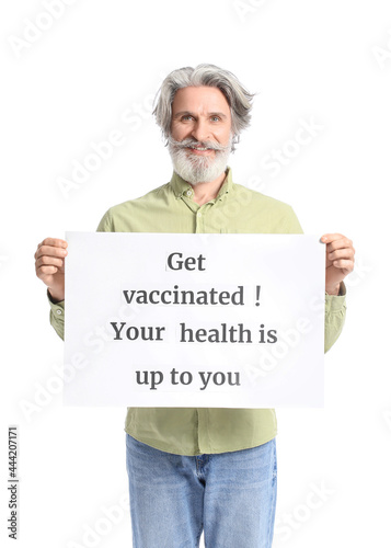 Senior man holding poster w...