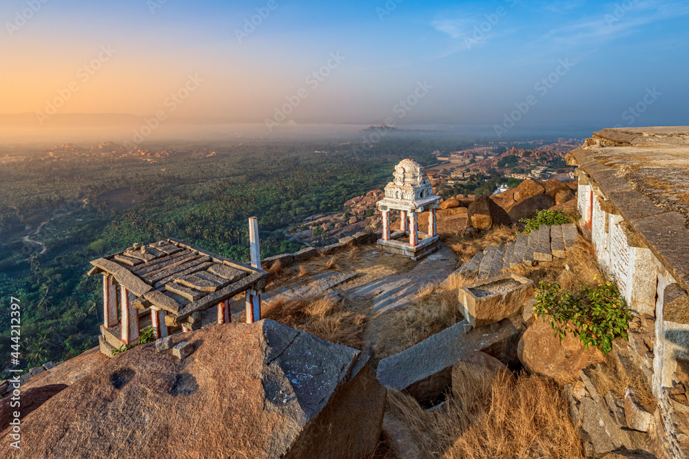 Obraz premium View of Matanga Hill during the sunrise, Unesco World Heritage town in Hampi, Karnataka, India