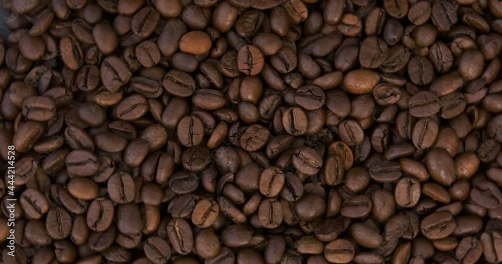Fresh roasted arabica coffee beans close up. Dark Coffee Grains. Top view. Rotating video. Loop motion. Fresh roasted arabica coffee beans close up. Dark Coffee Grains. Top view. Rotating video. Loop motion.