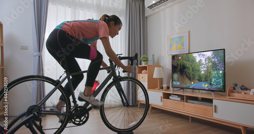 woman ride exercise bike photo