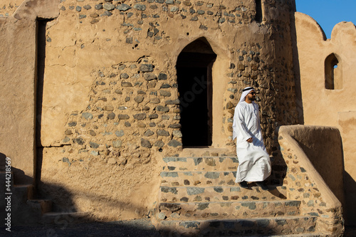 Middle Eastern Arab Emirati man exploring Fujairah Fort in the United Arab Emirates photo