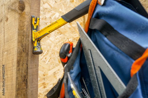 Carpenter tools in a waist belt 