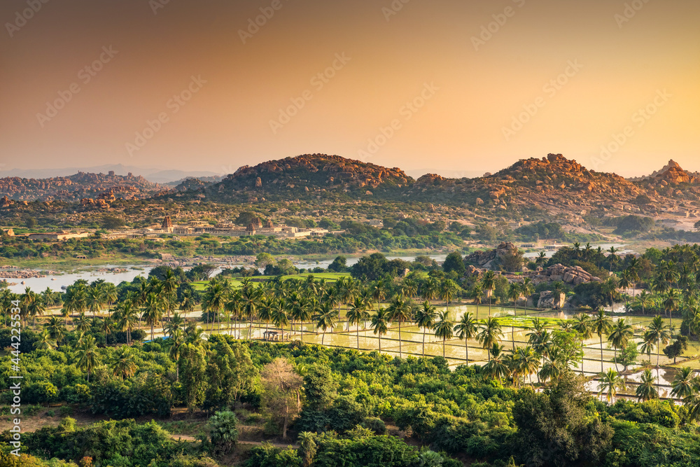 Sunset view with Vijaya Vitthala Temple shot is taken at Anjeyanadri Hill, Hampi, Karnataka india.