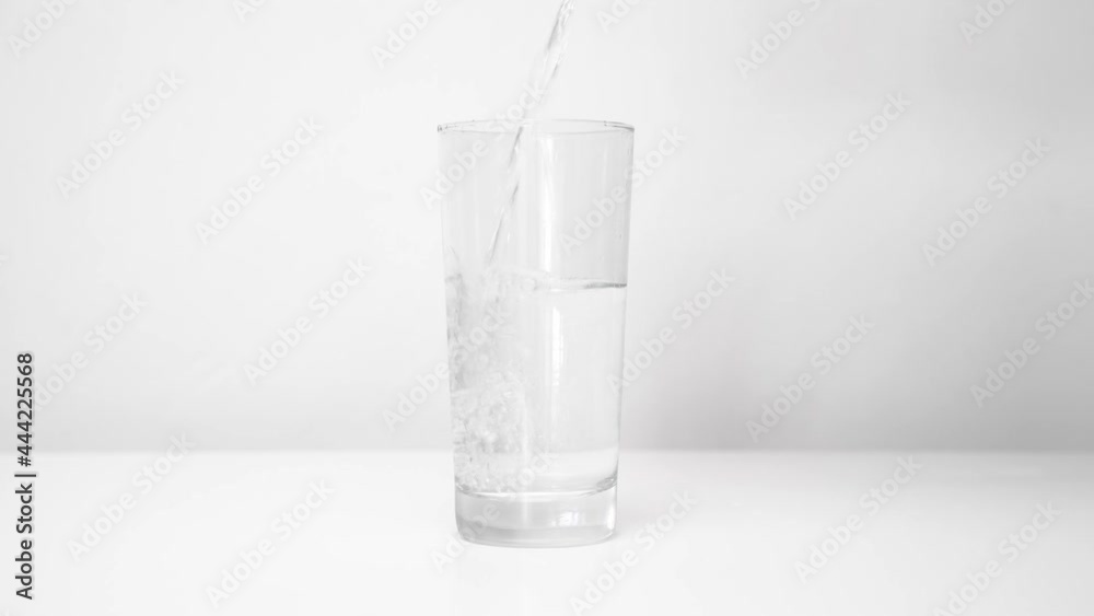 pour water from the kettle into the glass. clean drinking water. maintenance of water balance in the body. pour water from the kettle into the glass. clean drinking water. maintenance of water balance in the body.