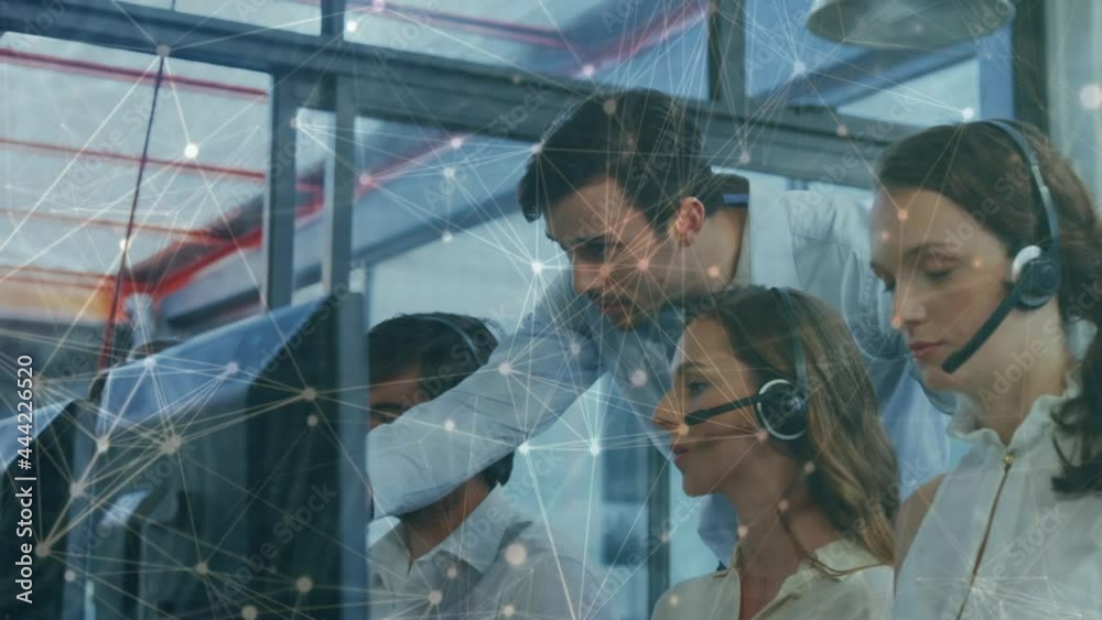 Animation of networks of connections over business people wearing phone headsets Animation of networks of connections over business people wearing phone headsets