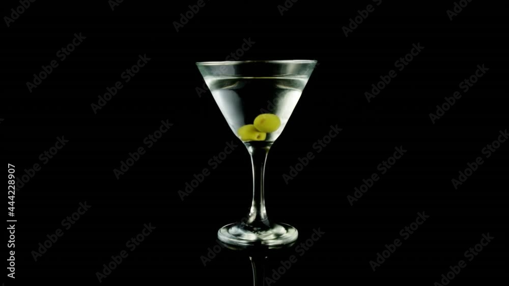 Animation of zigzag lines over wine and olives in wine glass on black background Animation of zigzag lines over wine and olives in wine glass on black background