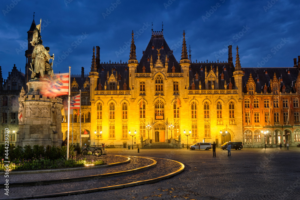 Famous tourist destination Grote markt square and Provincial Court building in Bruges, Belgium in the night