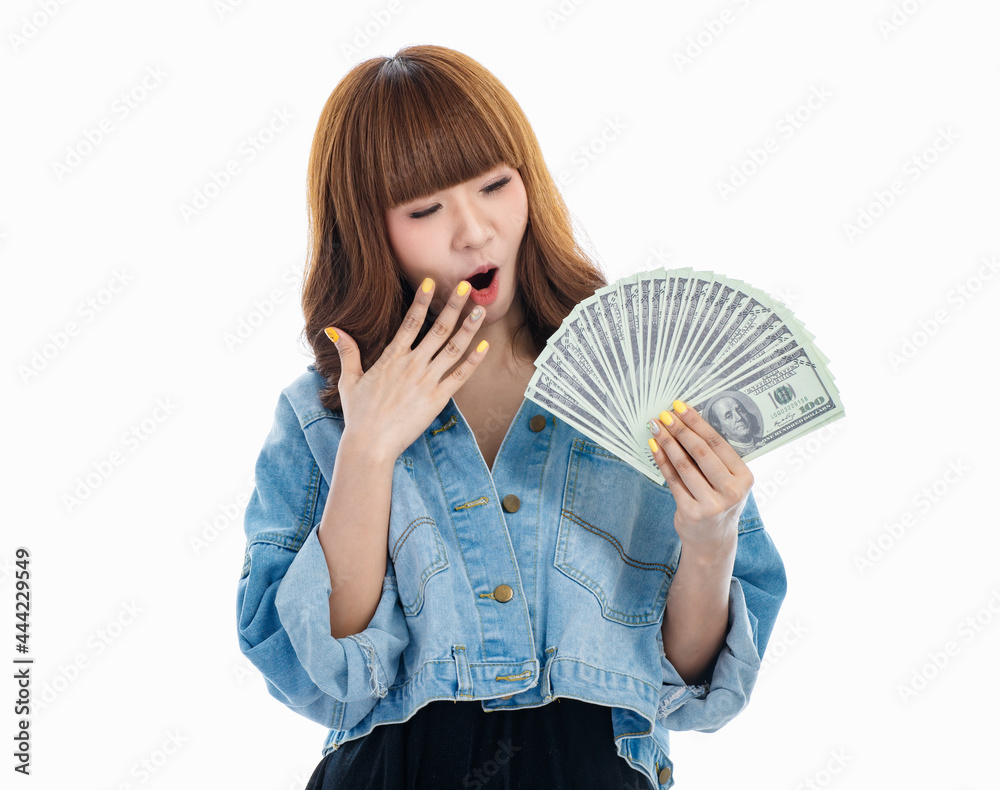 Asian woman smiles and holding American banknotes.. Asian woman smiles and holding American banknotes..