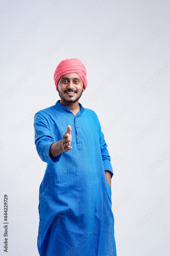 Young indian farmer giving expression on white background Young indian farmer giving expression on white background