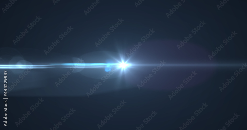 Bright blue spot of light glowing against black background