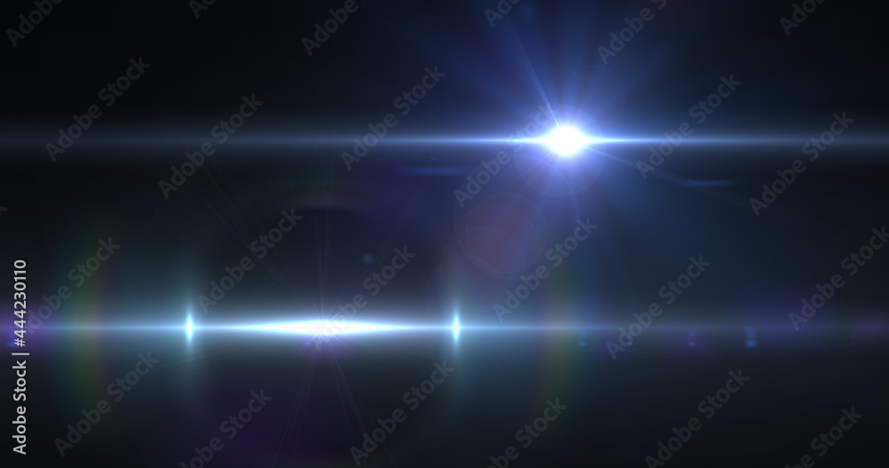 Bright blue spot of light moving against black background