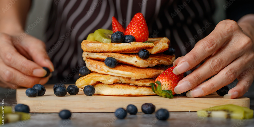 Woman preparing pancakes