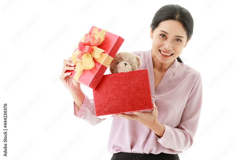 Portrait closeup isolated cut out shot of young happy Asian female housewife stand smiling open and hold cover of red birthday celebration present gift box of teddy bear doll from husband in hands Portrait closeup isolated cut out shot of young happy Asian female housewife stand smiling open and hold cover of red birthday celebration present gift box of teddy bear doll from husband in hands