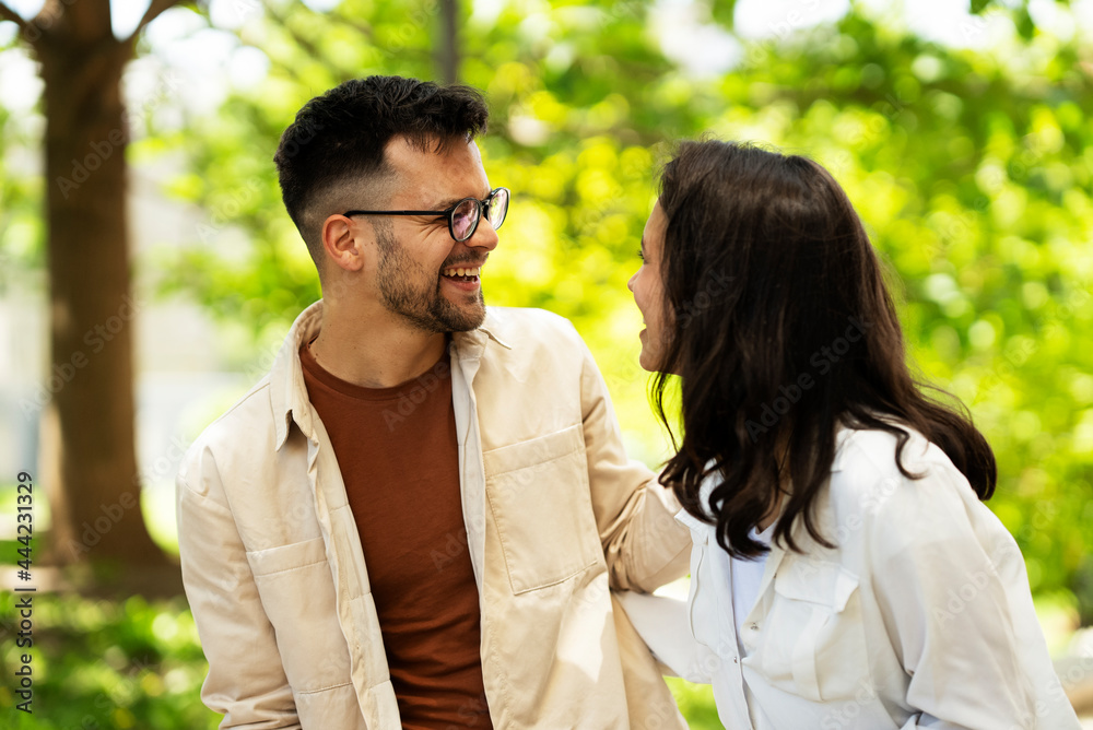 Happy young couple outdoors. Loving couple walking in the city... Happy young couple outdoors. Loving couple walking in the city...