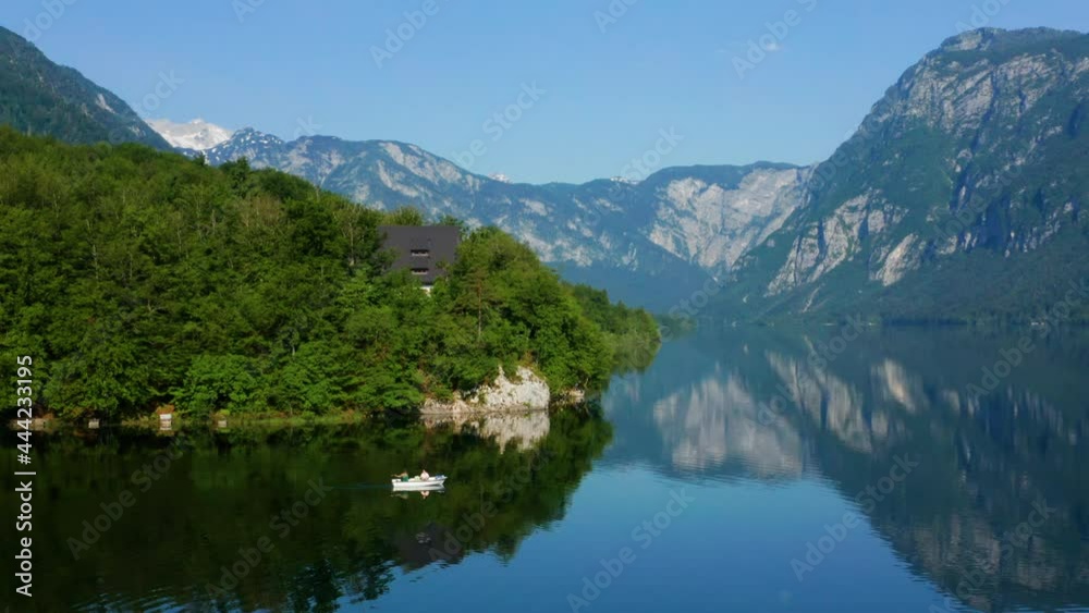 Magnificent View Of The Mountains Reflecting On Lake Bohinj In Slovenia - aerial shot Magnificent View Of The Mountains Reflecting On Lake Bohinj In Slovenia - aerial shot