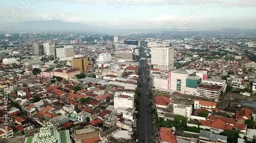 aerial city with road and mountain shadow