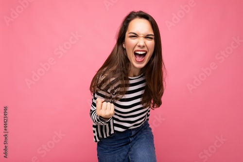 Photos Portrait of young positive happy beautiful brunet female person with sincere emo