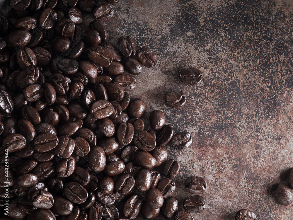 Background of roasted coffee beans on metal iron retro style. Background of roasted coffee beans on metal iron retro style.