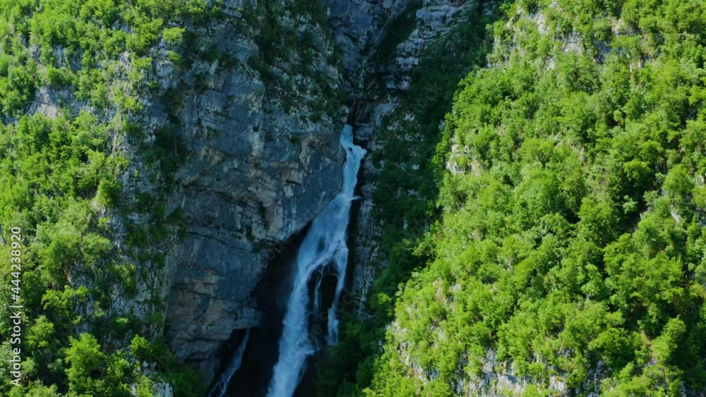 Savica Waterfall Surrounded With Rocky Cliffs In Triglav National Park In Slovenia. aerial Savica Waterfall Surrounded With Rocky Cliffs In Triglav National Park In Slovenia. aerial