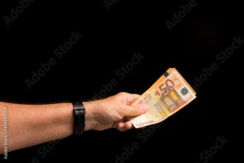 Money notes in a person's hand