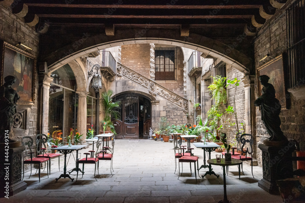 Restaurant courtyard with tables and chairs on a clear day