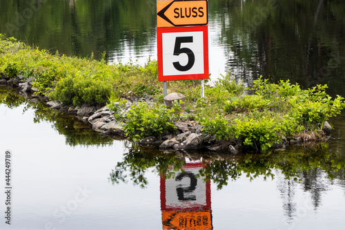 Haverud, Sweden A sign in Swedish for Lock or Sluss along the Dalsland Canal in western central Sweden. photo