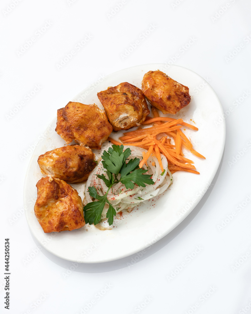 Fried juicy meat fillet or filet with vegetable salad. Food plate isolated on white background. Top view. Vertical format. Copy space. Fried juicy meat fillet or filet with vegetable salad. Food plate isolated on white background. Top view. Vertical format. Copy space.