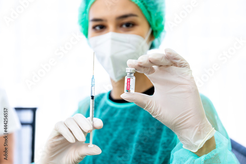 Doctor, woman nurse, scientist hand in white gloves holding bottle, syringe coronavirus, covid-19 vaccine disease preparing for a child, adult, man and woman vaccination shot medicine and drug concept
