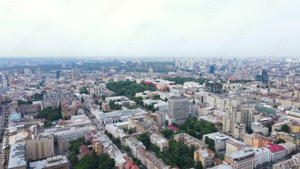 Flying over the buildings of the big city. Aerial view of the cityscape Flying over the buildings of the big city. Aerial view of the cityscape