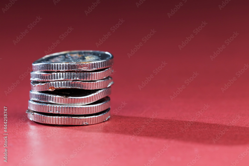 broken bent and rusting metal coins