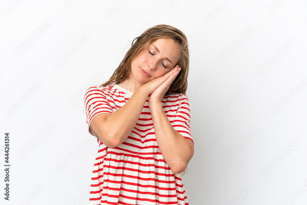 Young caucasian woman isolated on white background making sleep gesture in dorable expression Young caucasian woman isolated on white background making sleep gesture in dorable expression