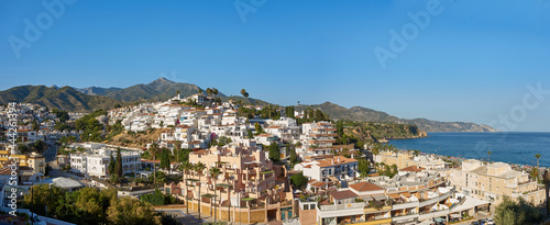 Panoramic view of Burriana beach located in Nerja famous for the nearby cliffs and the beach bars where you can eat paella and typical dishes of the area photo