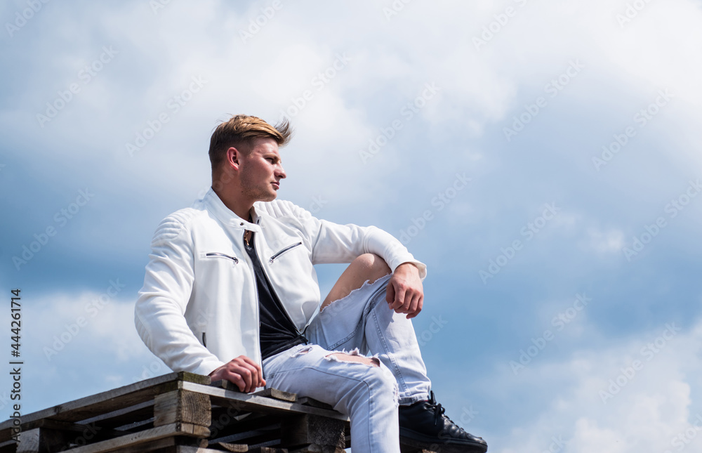 young confident guy in white urban clothes outdoor, fashion young confident guy in white urban clothes outdoor, fashion