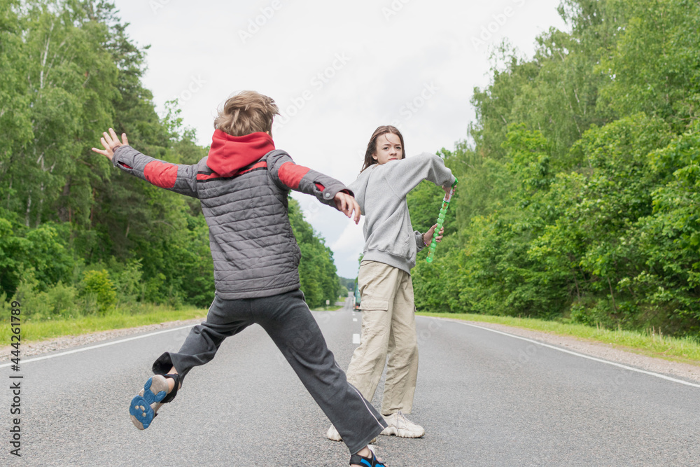 Children play on the highway outside the city Children play on the highway outside the city