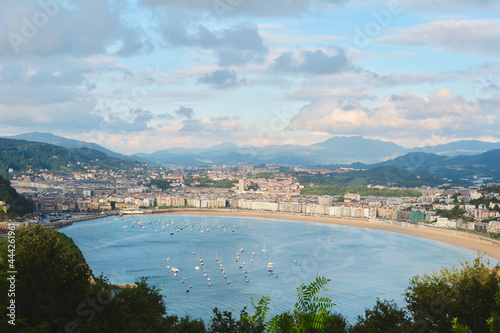 Panoramic view of Biscay bay and La Concha coastal street at sunset in San Sebastian, Donostia, Basque country, Spain