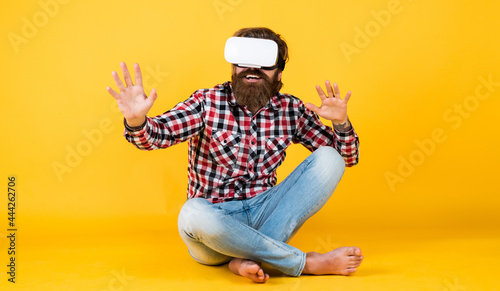 brutal bearded man wear checkered shirt having lush beard and moustache in vr glasses, innovations