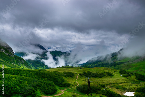 alpin landscape with a hiking path and clouds (Vorarlberg, Austria)
