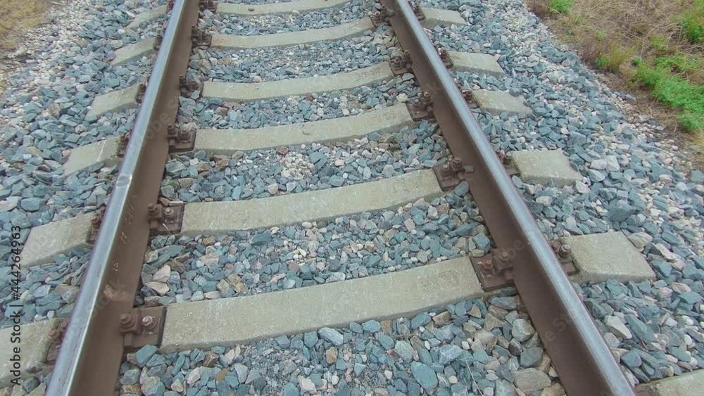 Moving Backward Along the Railroad Track. European Railway for Electric Train - Smooth Movement on Gimbal Stabilizer Moving Backward Along the Railroad Track. European Railway for Electric Train - Smooth Movement on Gimbal Stabilizer