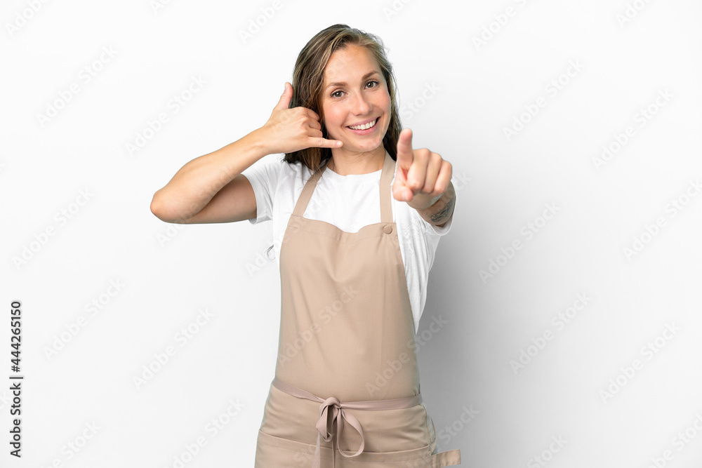 Restaurant waiter caucasian woman isolated on white background making phone gesture and pointing front Restaurant waiter caucasian woman isolated on white background making phone gesture and pointing front