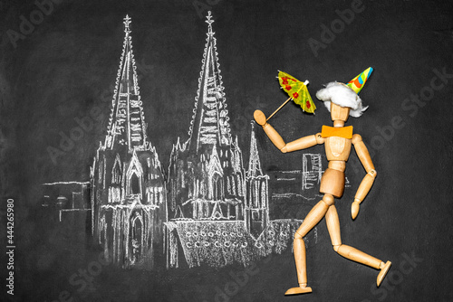 Celebrating man against the background of Cologne Cathedral drawn on chalkboard photo