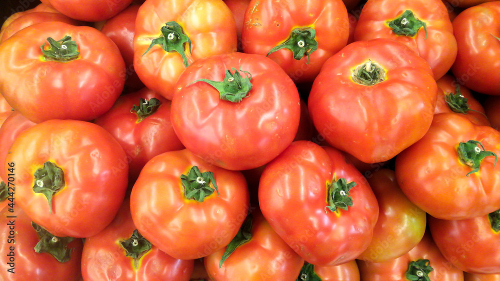 pile of red and yellow tomatoes in market pile of red and yellow tomatoes in market