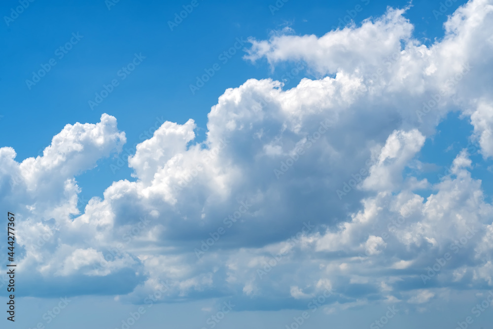 Natural daylight and white and dark blue clouds floating on blue sky. White fluffy clouds and blue sky Natural daylight and white and dark blue clouds floating on blue sky. White fluffy clouds and blue sky