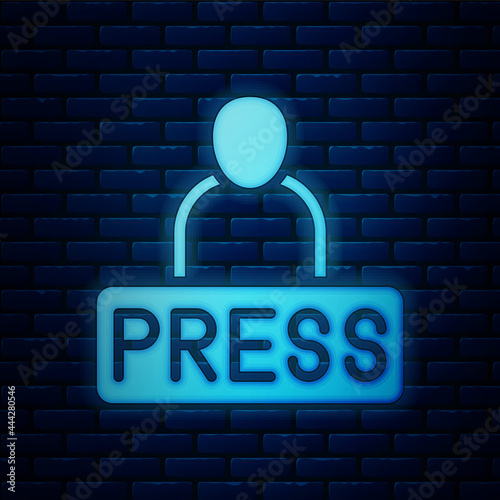 Glowing neon Journalist news reporter icon isolated on brick wall background. Vector