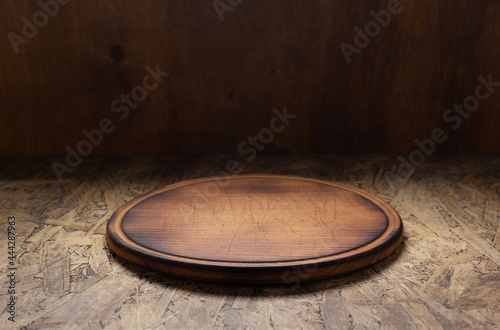 Pizza cutting board for homemade bread cooking or baking on table. Wooden tabletop background