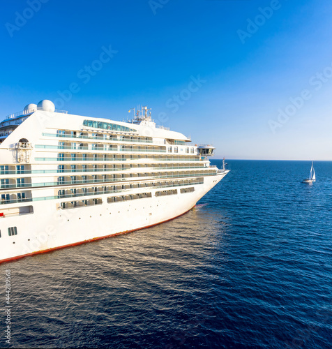 Fototapeta Naklejka Na Ścianę i Meble -  Luxury cruise liner and tiny yacht in mediterranean sea