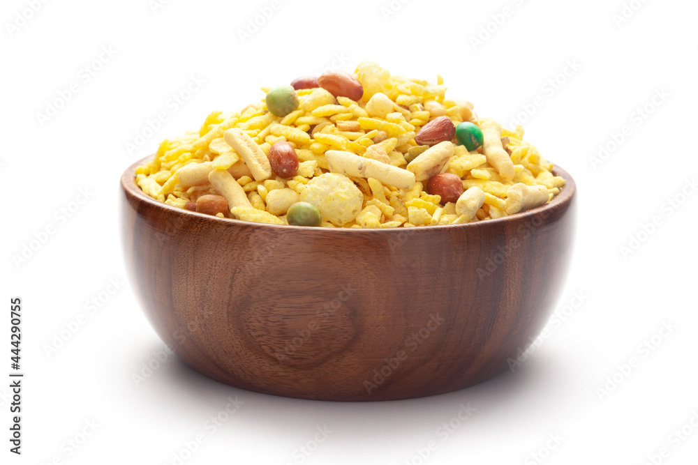 Delicious Khatta Meetha In hand-made (handcrafted) wooden bowl, made with peanuts, sugar, raisins, and besan sev. Pile of Indian spicy snacks (Namkeen) Delicious Khatta Meetha In hand-made (handcrafted) wooden bowl, made with peanuts, sugar, raisins, and besan sev. Pile of Indian spicy snacks (Namkeen)