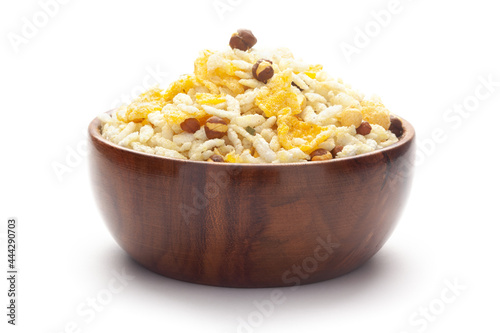 Close-Up of Crunchy Diet Mixture In hand-made (handcrafted) wooden bowl made with Puffed Rice, Corn Flakes, and Curry leaves. Indian spicy snacks (Namkeen), photo