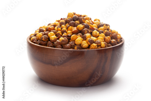 Close-Up of Crunchy Roasted Chana Masala In hand-made (handcrafted) wooden bowl, made with Bengal Grams or Chickpeas. Indian spicy snacks (Namkeen),
