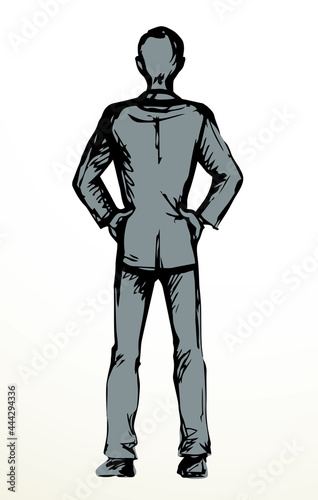 Standing man. Back view. Vector drawing